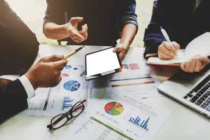 Collaborative Growth - Real Estate Professionals Engaged in Discussion at a Free Investor Group Meeting